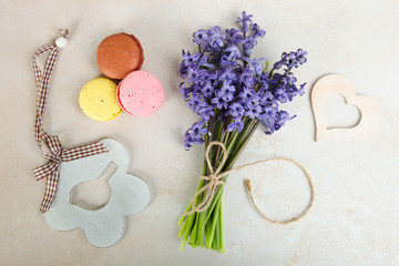 A bouquet of flowers and macaroons