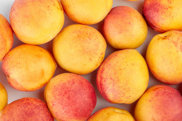 Isolated apricots. Fresh apricot fruit isolated on white background. Tropical abstract background. Fresh fruits. Place for your text.