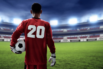 Fototapeta premium Soccer goalkeeper holding soccer ball