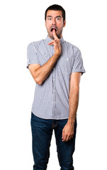 Handsome man making suicide gesture on isolated white background
