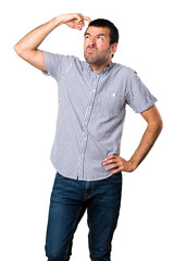 Fototapeta premium Handsome man having doubts on isolated white background