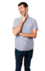 Fototapeta premium Handsome man looking lateral on isolated white background