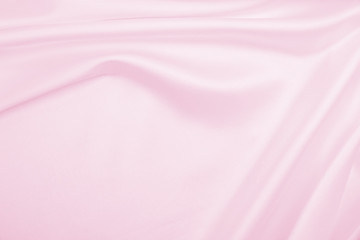 Smooth elegant pink silk or satin texture as wedding background. Luxurious background design