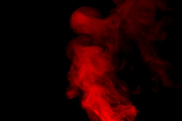 Red smoke isolated on black background.