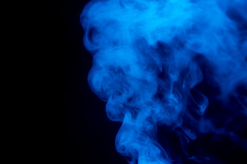Blue smoke isolated on black background.