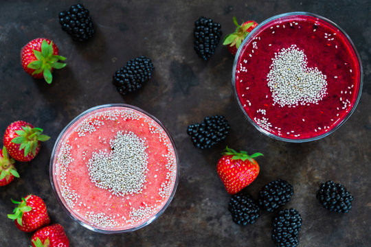 Strawberry and blackberry smoothies garnished with chai seeds - top view. Healthy breakfast idea.