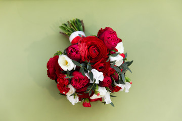 Beautiful wedding bouquet with red and white roses