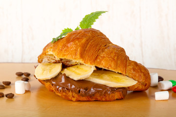 Croissant with chocolate and banana