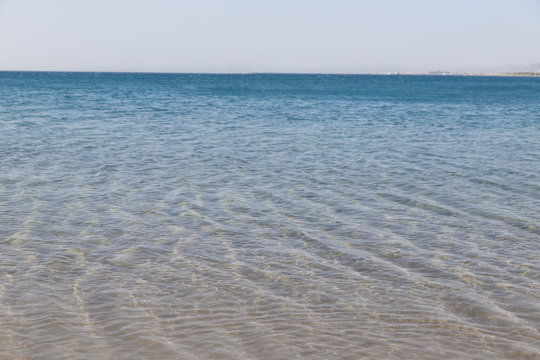 Fototapeta Soft waves on sandy beach