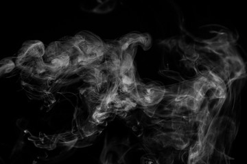 White smoke isolated on black background.