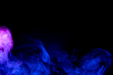 Red and blue smoke isolated on black background.