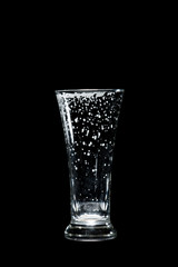empty craft beer glass on black background