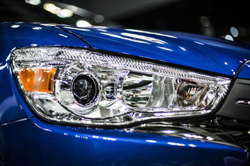 headlight of modern blue car with led and xenon optics