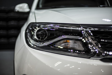 headlight of white modern car with led and xenon optics