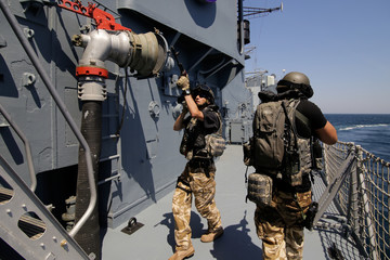 Romanian special forces marines are dropped in a rubber speed boat from the ‘Regele Ferdinand’ frigate,