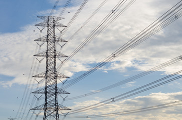 Fototapeta premium Hight Voltage Pole and The Blue Sky with Clouds.