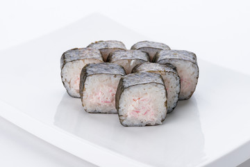 Sushi set and composition at white background. Japanese food restaurant, sushi maki gunkan roll plate or platter set.
