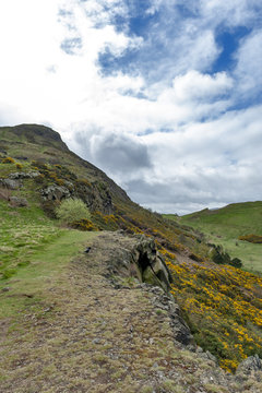 A hillwalking route through grassy slopes up to Arthur’s Seat, the highest point in Edinburgh located at Holyrood Park, Scotland, UK