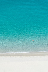 Beautiful empty sandy beach and turquoise sea from above