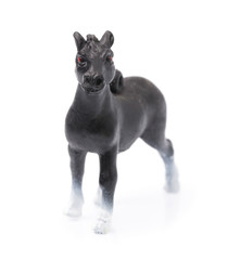 Toy horse made of plastic isolated on white background