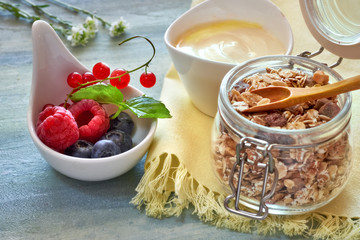 Jar of muesli with yogurt and berries, healthy dessert