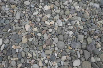 pebble on beach on sunny day abstract pattern texture background