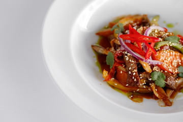 Warm salad with meat and vegetables