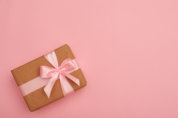Wrapped gift box with pink ribbon bow