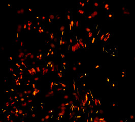 Plakat flame of fire with sparks on a black background