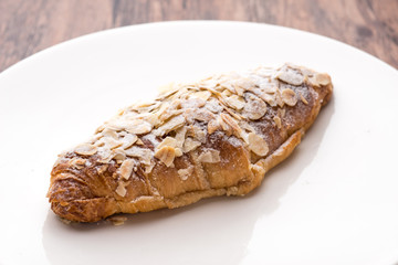 Almond croissant  filled with almond cream and topped with sliced almonds
