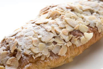 Almond croissant  filled with almond cream and topped with sliced almonds