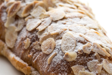 Almond croissant  filled with almond cream and topped with sliced almonds