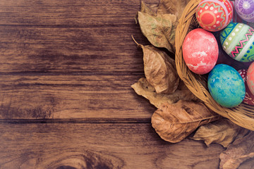 Colorful Easter egg side border against a rustic wood Vintage pastel background