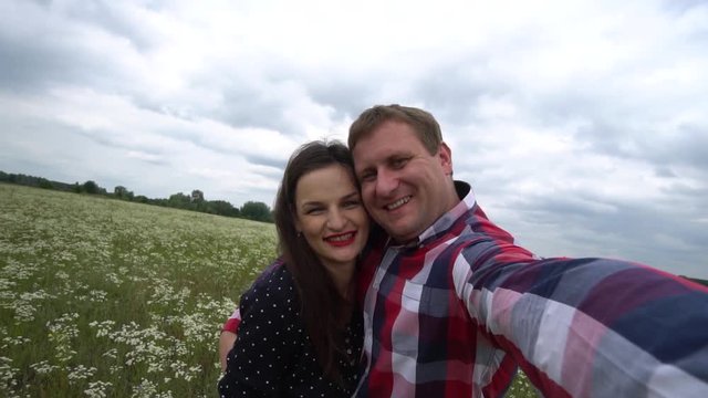 Romantic Happy Couple In Love Taking Photos On Phone In Nature.