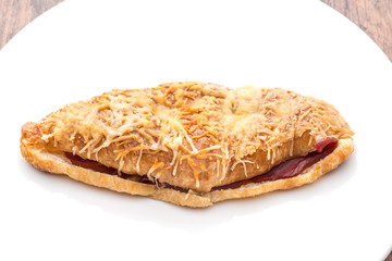 croissant ham cheese on white plate