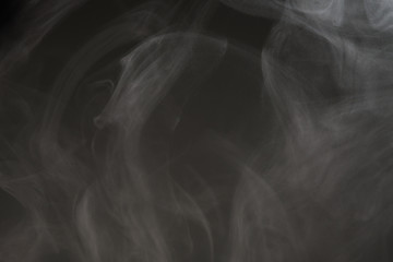 White smoke isolated on black background.