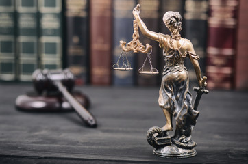 Scales of Justice, Justitia, Lady Justice, Judge Gavel and Law books in the background.
