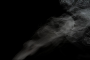 White smoke isolated on black background.