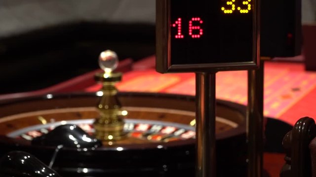 casino roulette wheel with the ball on number