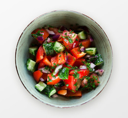 Bowl of vegetable salad isolated on white background