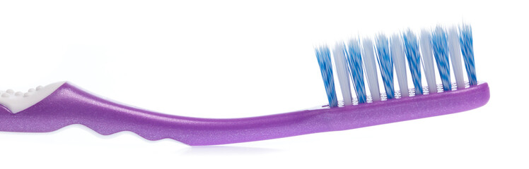 a purple toothbrush isolated on white background