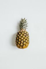 Ripe pineapple on white background isolated. Minimalist style trendy tropical concept.