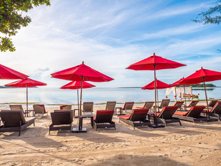 Umbrella and chair on the tropical beach sea and ocean