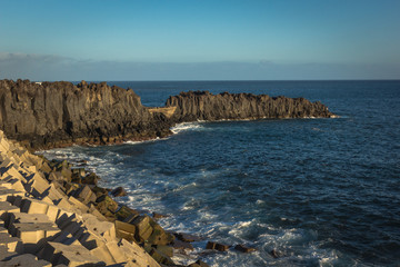 Rocks over the Atlantic ocean in Camara de Lobos, Madeira, Portugal
