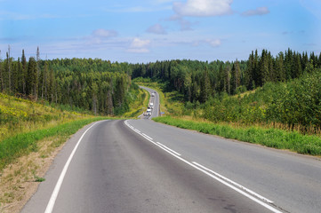 Obraz premium Asphalt road across the hills