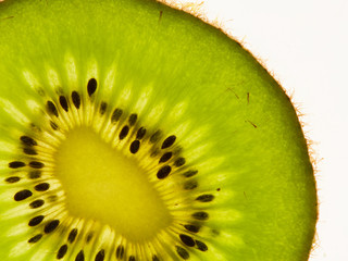 Fresh, beautiful,kiwi, sliced, photographed in macro closeup on white background.