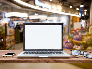 Laptop with blank screen and mouse