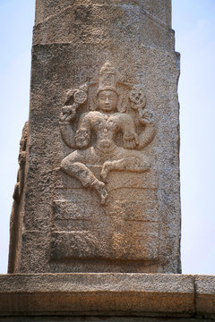 Carved figures of seated Kushmandini on the north side of the Manasthambha in front of Parsvanatha basadi or basti, Chandragiri hill, Sravanabelgola, Karnataka