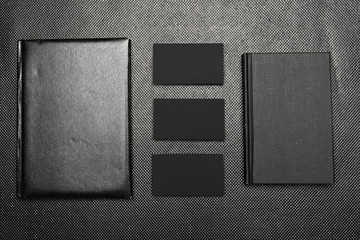 Black paper pieces mock up top view on black background