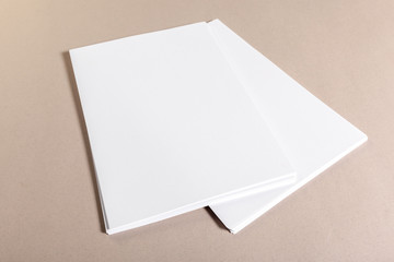Blank paper pieces for mock up on a beige background
